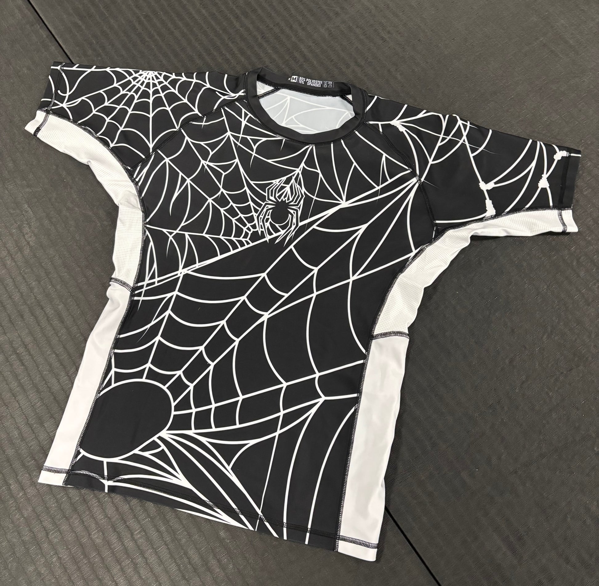 "CAUGHT" Rash Guard